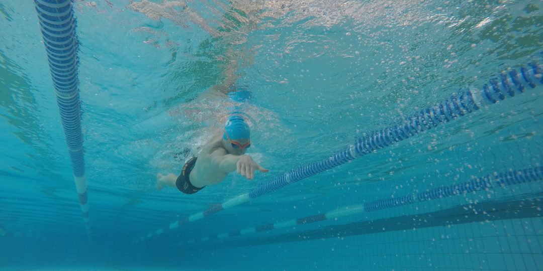 lukejonestri reaching forward swimming